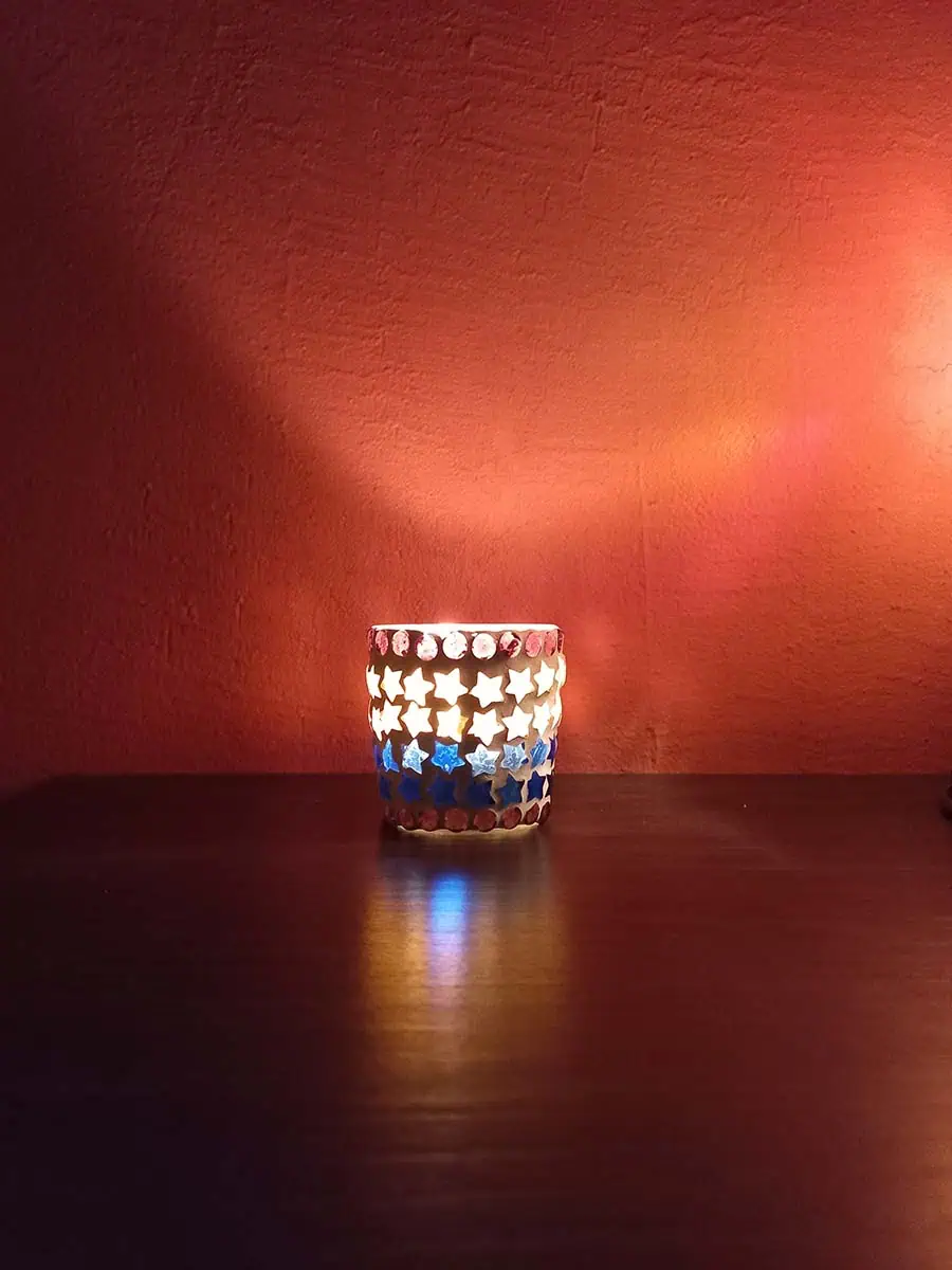 Portavela de vidrio con estrellas